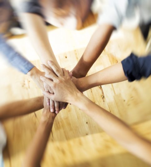 Business group with hands together - teamwork concepts